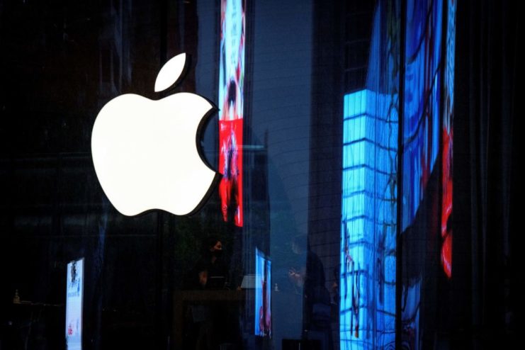 Apple logo surrounded by brightly lit windows