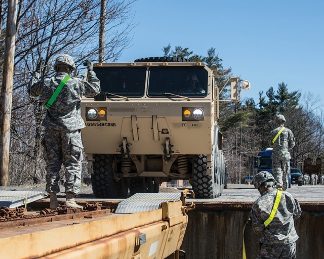 Soldiers assigned to the 110th Transportation Company, 548th Combat Sustainment Support Battalion, 10th Sustainment Brigade, line up a palletized loading system to be loaded on a railcar before conducting railhead operations training April 15. The tr... (Photo Credit: U.S. Army)