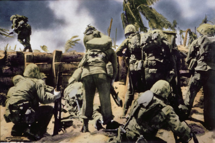 Marines standing behind a log wall