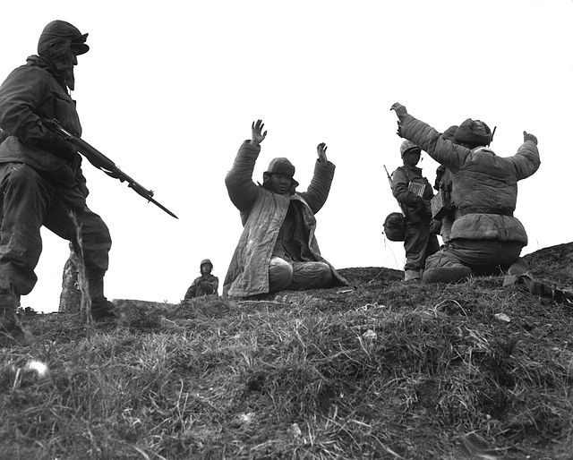 US Marines surround Chinese PVA soldiers