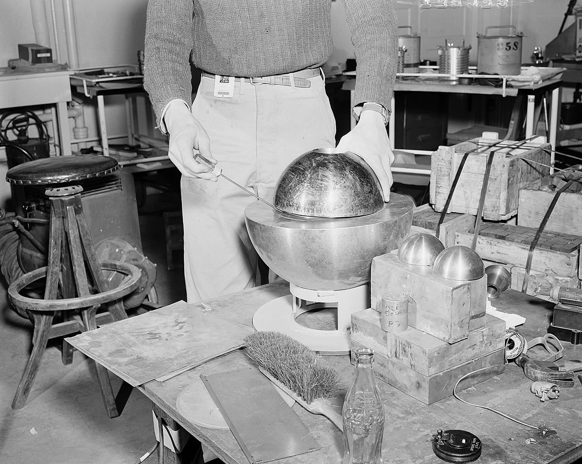 A re-creation of the 1946 experiment. The half-sphere is seen, but the core inside is not. The beryllium hemisphere is held up with a screwdriver. (Photo Credit: Los Alamos National Laboratory)