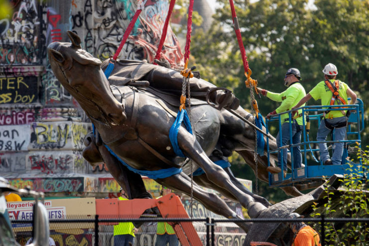 Robert E. Lee statue tipped over by work crews