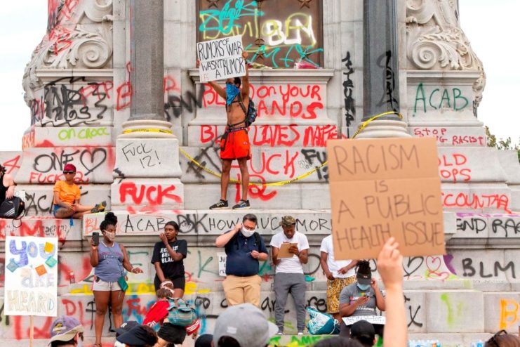 Protestors holding signs during Black Lives Matter protests