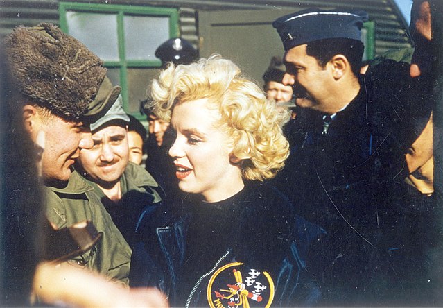 Marilyn Monroe surrounded by American troops