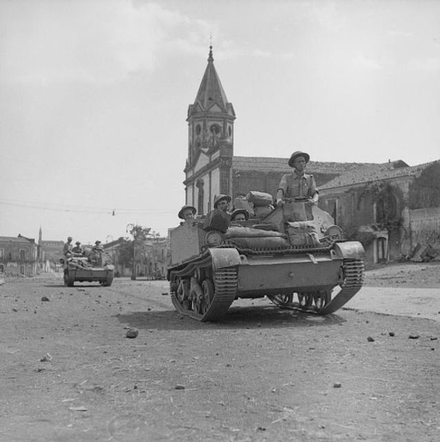 British soldiers atop a tank in Sicily