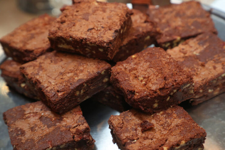 Brownies stacked on a metal plate