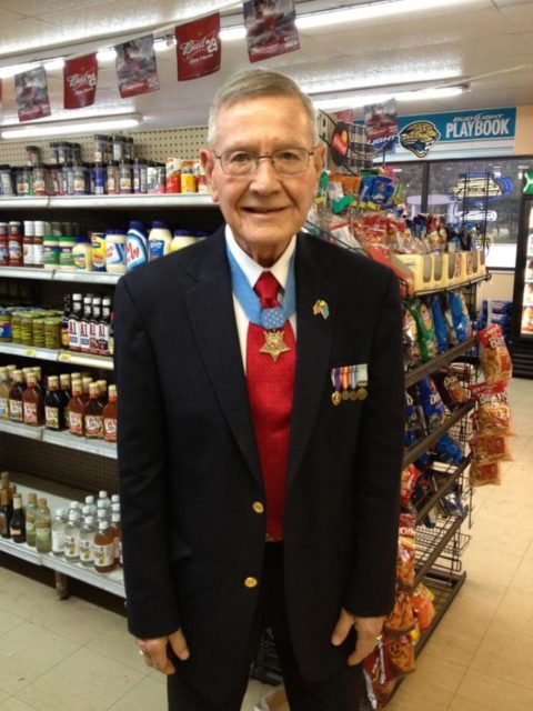 Duane Dewey standing in a grocery store