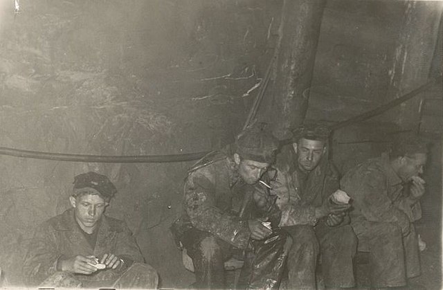 Four male political prisoners on lunch break