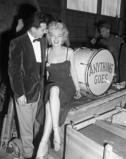 Corporal Al Guastafeste staring at a laughing Marilyn Monroe