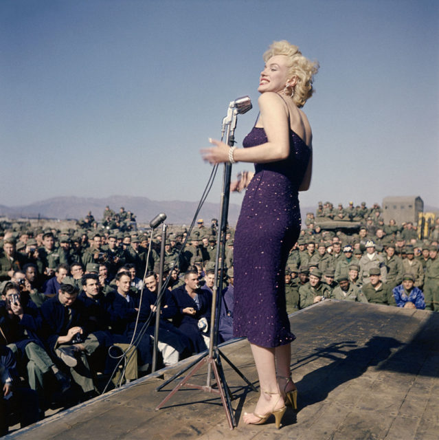 Marilyn Monroe performing for a group of GIs