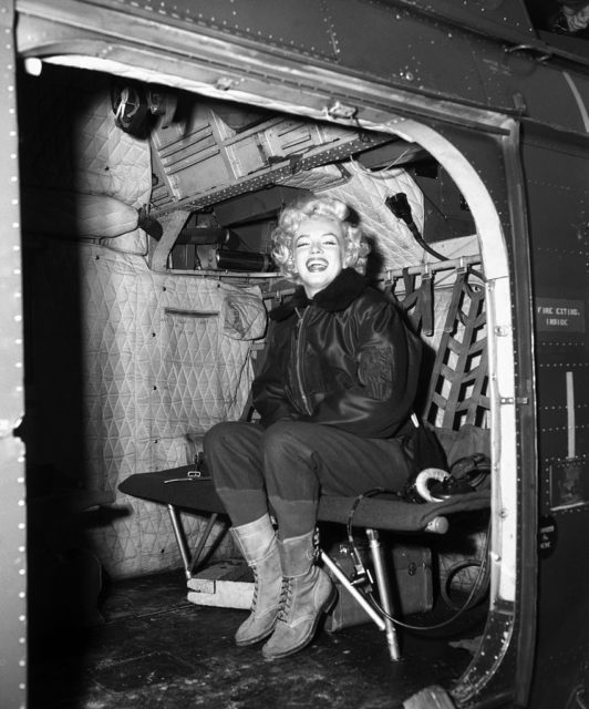 Marilyn Monroe sitting in a helicopter