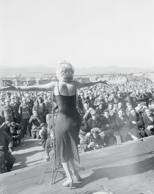 Marilyn Monroe performing for a crowd of American troops