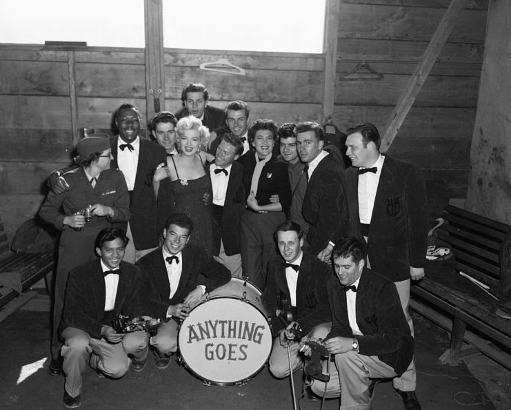 Marilyn Monroe standing with the members of Anything Goes