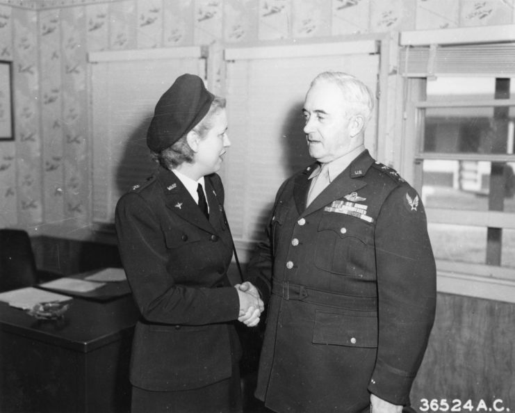 Jacqueline Cochran shaking hands with Barton Kyle Yount