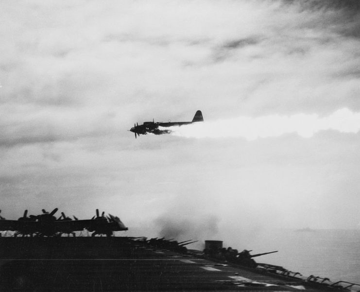 Japanese kamikaze plane on fire in the sky