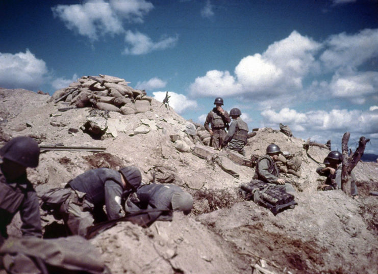 US troops positioned on a hill