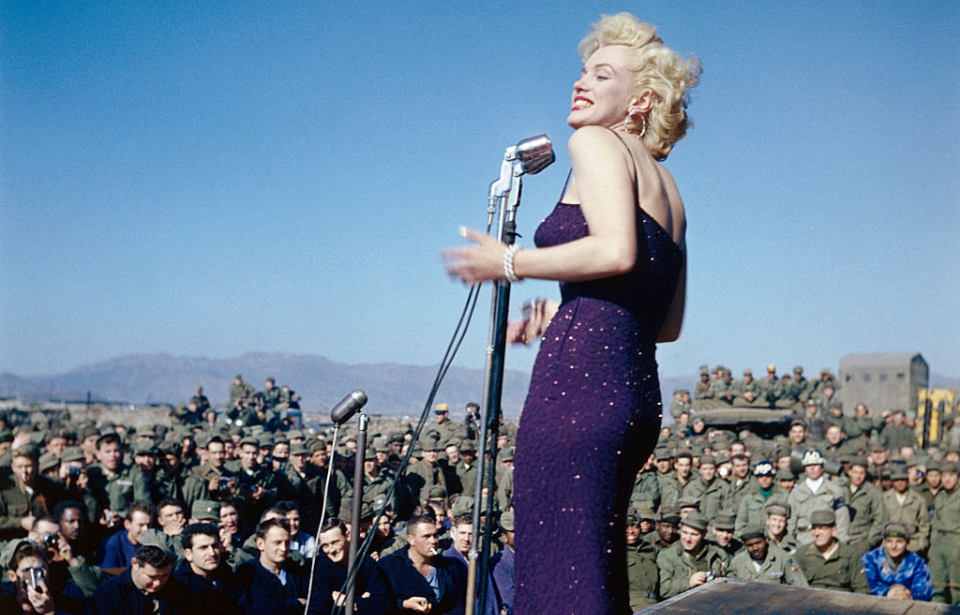 Marilyn Monroe performing in front of an audience of American troops
