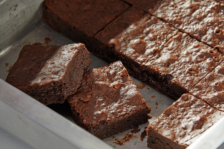 Brownies cut up in a baking pan