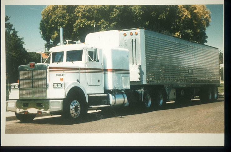 Transport truck with a white cab