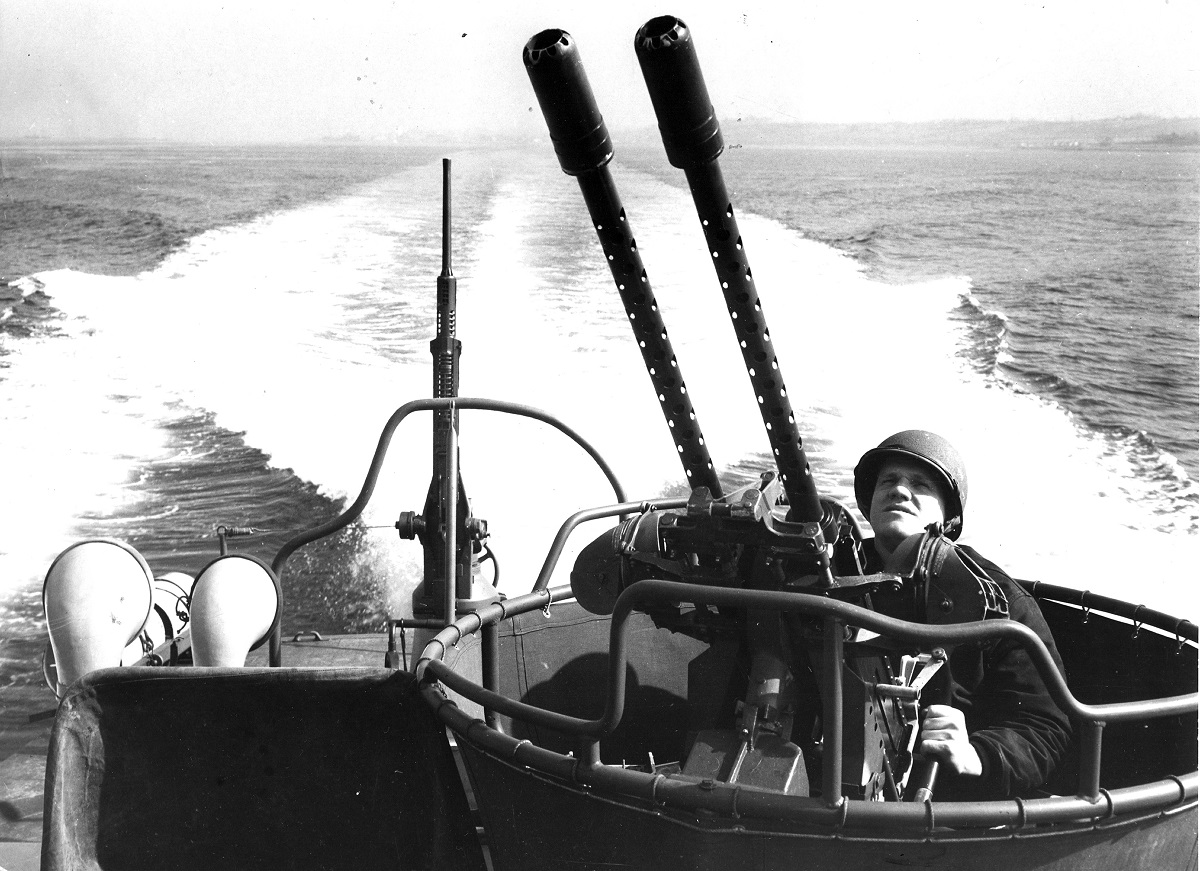 A sailor in training to handle a US Navy PT torpedo boat mans one of the twin 50 cal AA machine guns which form the ship's aerial defenses, circa 1944.(Photo by PhotoQuest/Getty Images)