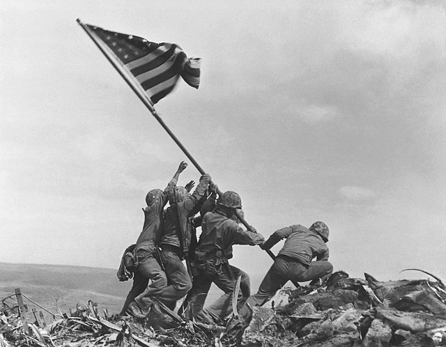 Soldiers raising the American flag at Iwo Jima