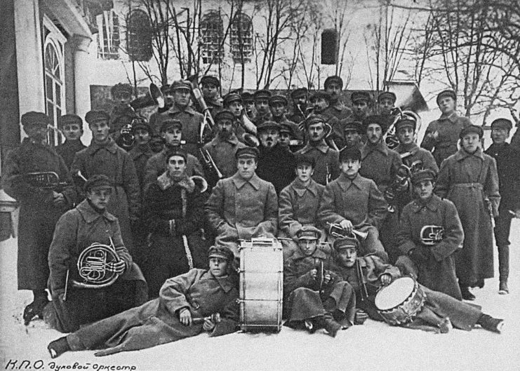 Male prisoners posing with instruments