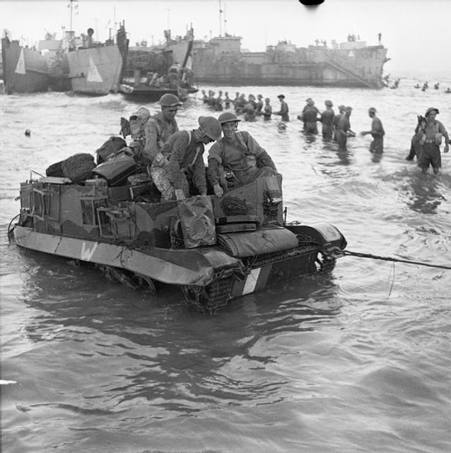 Soldiers aboard an amphibious tank