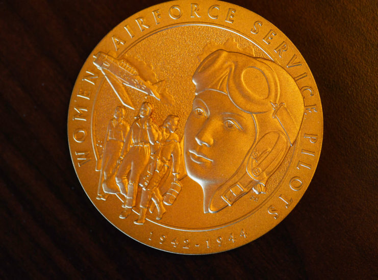 Gold medal featuring female pilots