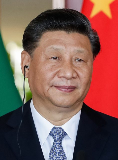 Xi Jinping wearing an earpiece