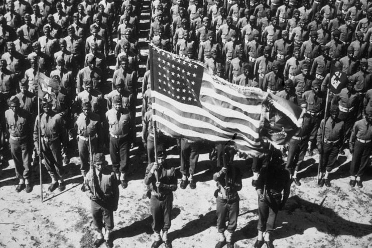 Soldiers with the 41st Corps of Engineers standing with the American flag