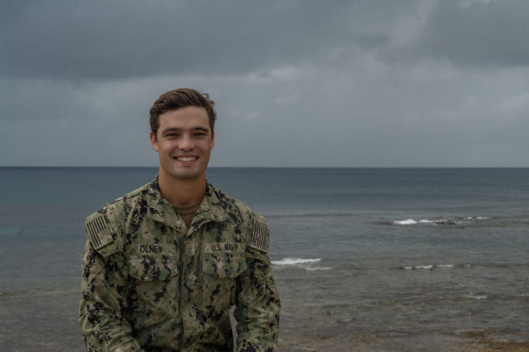 AEAN Ian Olney standing on a beach in uniform