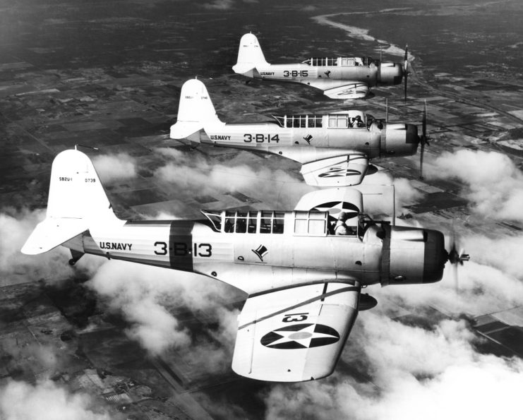 Three US Navy dive bombers flying in formation