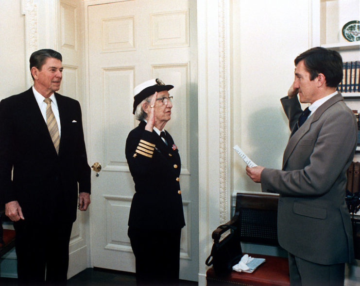 Ronald Reagan watching as Grace Hopper is promoted to the rank of commodore by Secretary of the Navy John Lehman