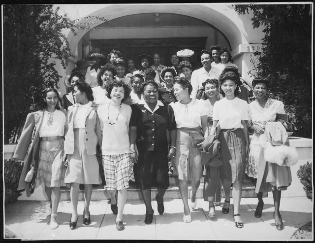 Hattie McDaniel standing with members of the Negro Division of the Hollywood Victory Committee