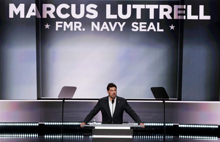 Marcus Luttrell speaking at a podium