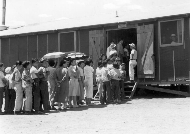 Japanese-Americans lining up outside the mess hall at Manzanar War Relocation Center