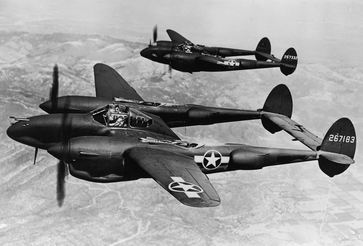 circa 1943:  Two Lockhead P-38 Lightning aircraft fly on the Pacific Front during World War II.  (Photo by Hulton Archive/Getty Images)