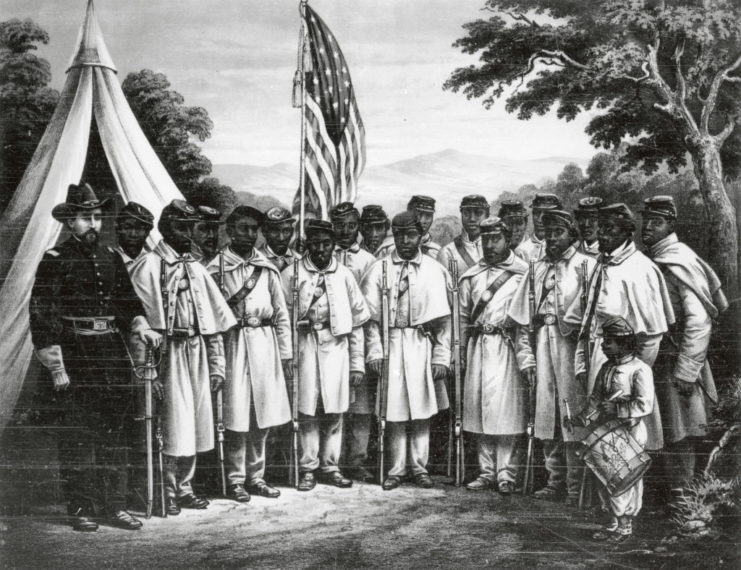 Group of African American soldiers standing in front of the American flag