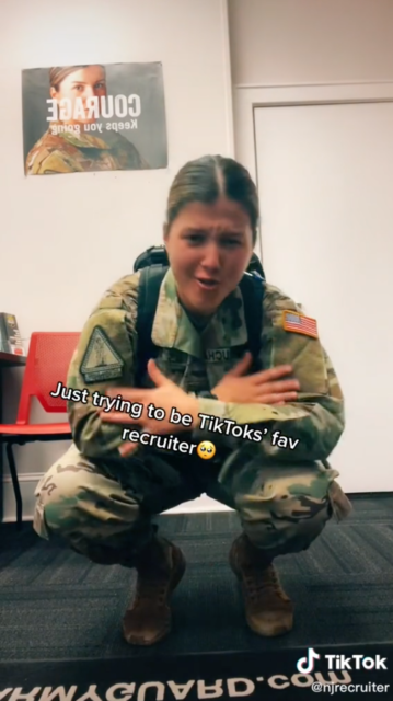 Sergeant Georgia Varoucha crouching down