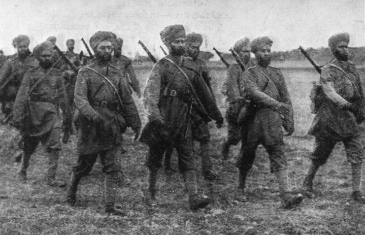 Sikh soldiers marching together across a field