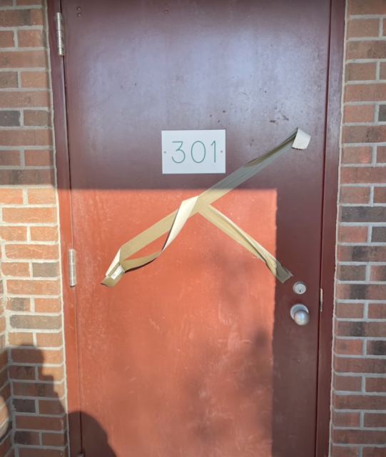 Orange door taped off
