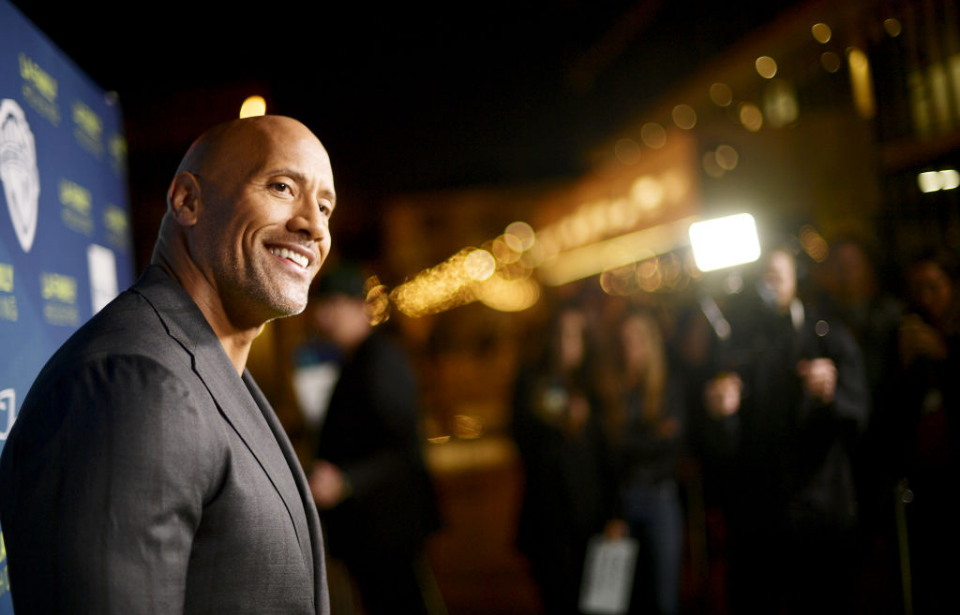 Dwayne "The Rock" Johnson smiling at a camera