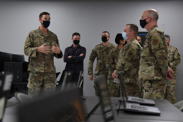 US Air Force personnel speaking with one another