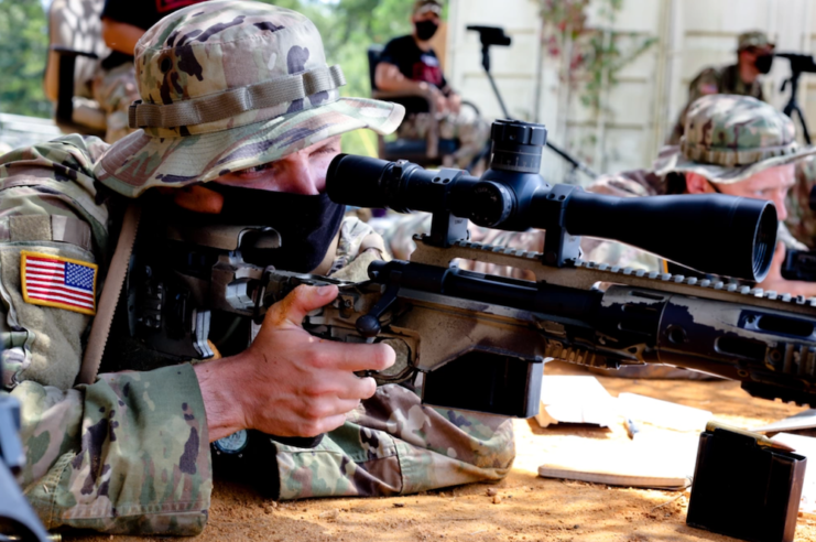 Spc. Amyson Brinkman aiming M2010 .300 Win Mag Bolt Action Rifle