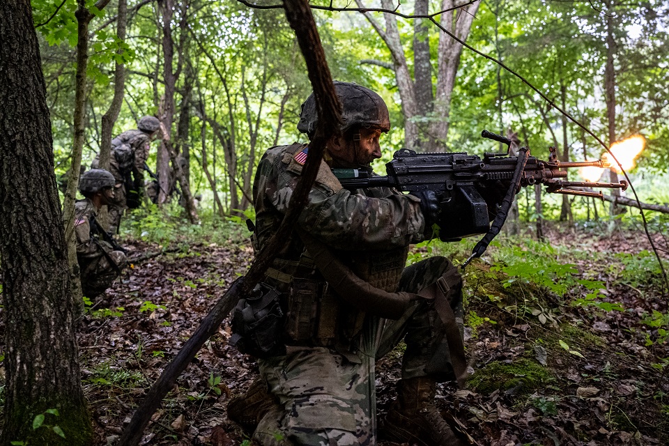 FORT KNOX, KY - JULY 01: A cadet wielding an M249 fires in the direction of their opposing forces near the objective while other cadets move forward in Training Area 9 during Army ROTC Cadet Summer Training on July 1, 2021 in Fort Knox, Kentucky. 3rd Regiment participated in a field training exercise (FTX) in which units scouted and moved into unknown territory to engage opposing forces and then secure the mission area. Cadet Summer Training 2020 was effectively canceled at Fort Knox due to the COVID-19 pandemic. (Photo by Jon Cherry/Getty Images)