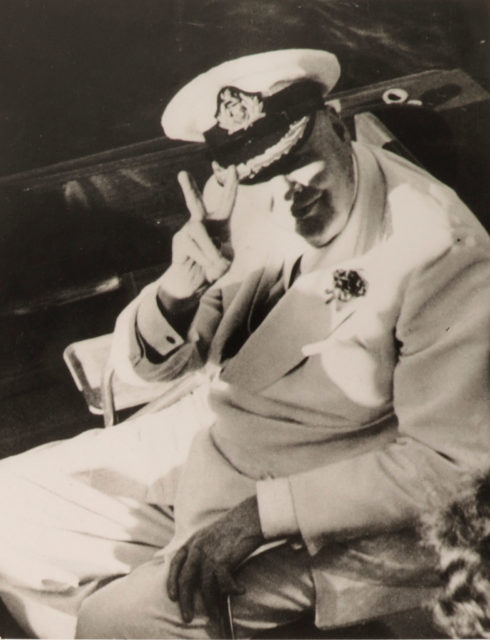 Winston Churchill holding up his famous "V" sign