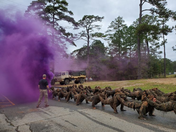 US Army Sniper School trainees during camouflage training