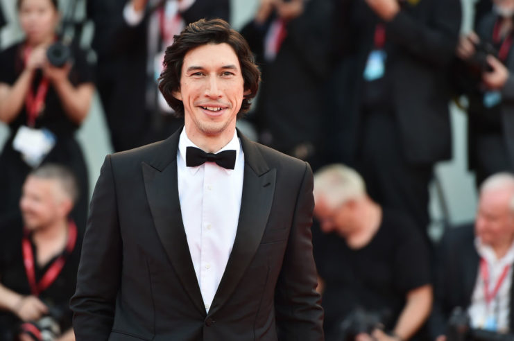 Adam Driver posing on a red carpet