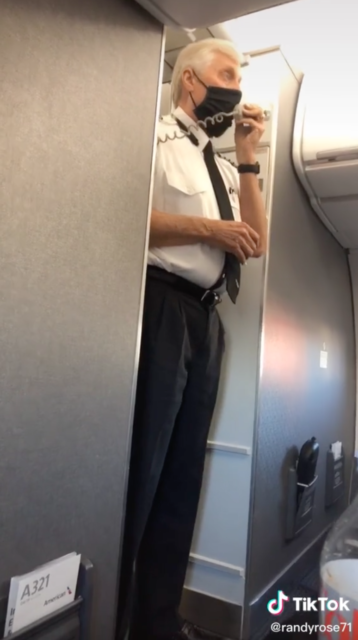 Pilot speaking into a telephone