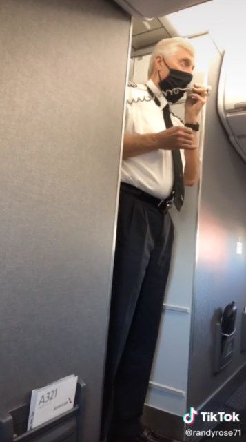 Pilot speaking into a telephone